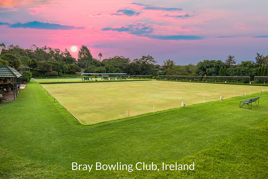 Lush green Lawn bowling field during sunset